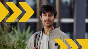 Male student standing outside in the campus