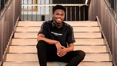 Engineering student sitting on the stairs