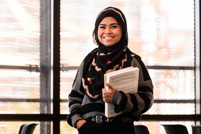 girl student with books in hand