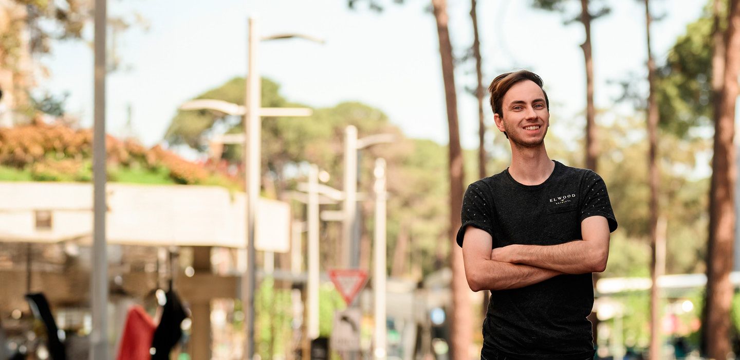 Boy student standing in college