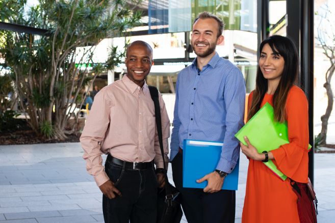 Campus group holding folders