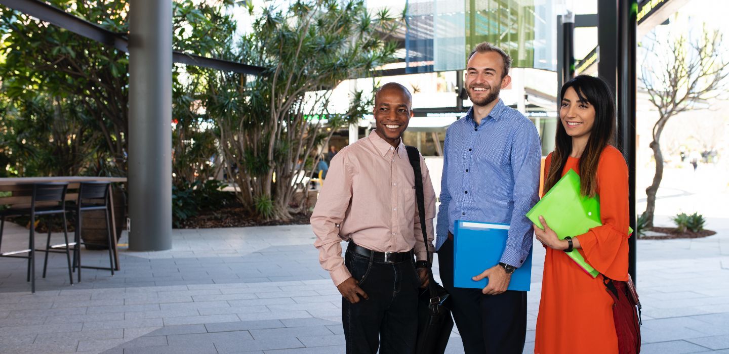 Campus group holding folders