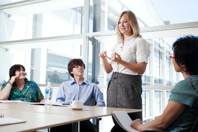 Campus group in meeting talking
