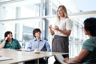 Campus group in meeting talking