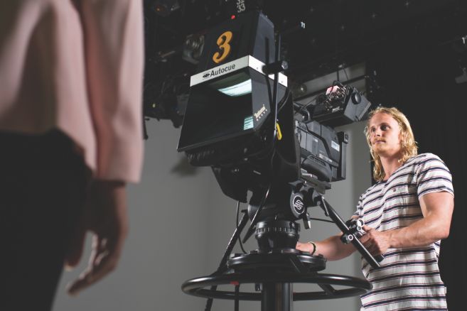 Campus male using camera