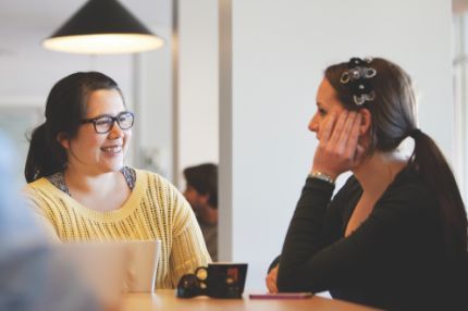 Campus two females talking