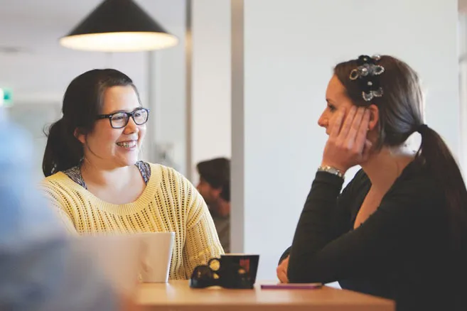 Campus two females talking