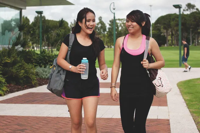 Campus two females walking