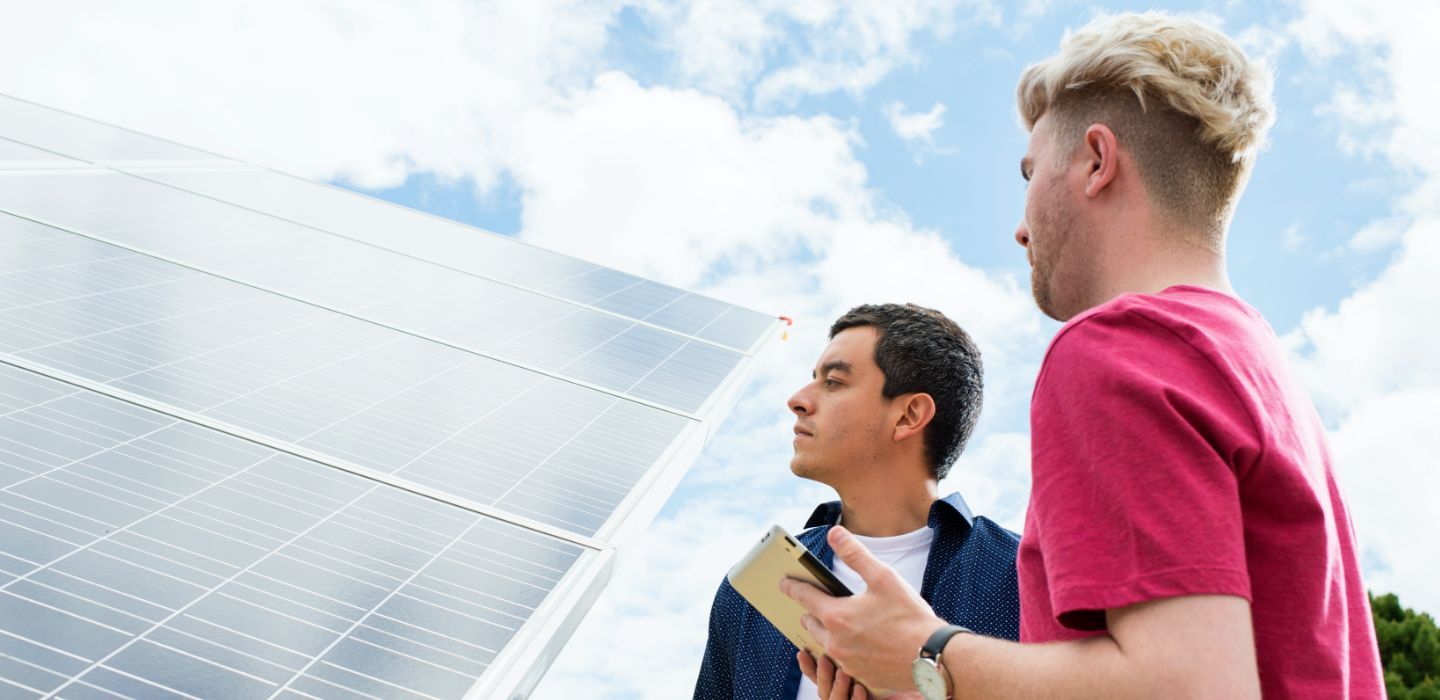Campus two males talking outdoors