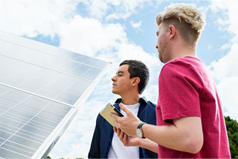 Campus two males talking outdoors