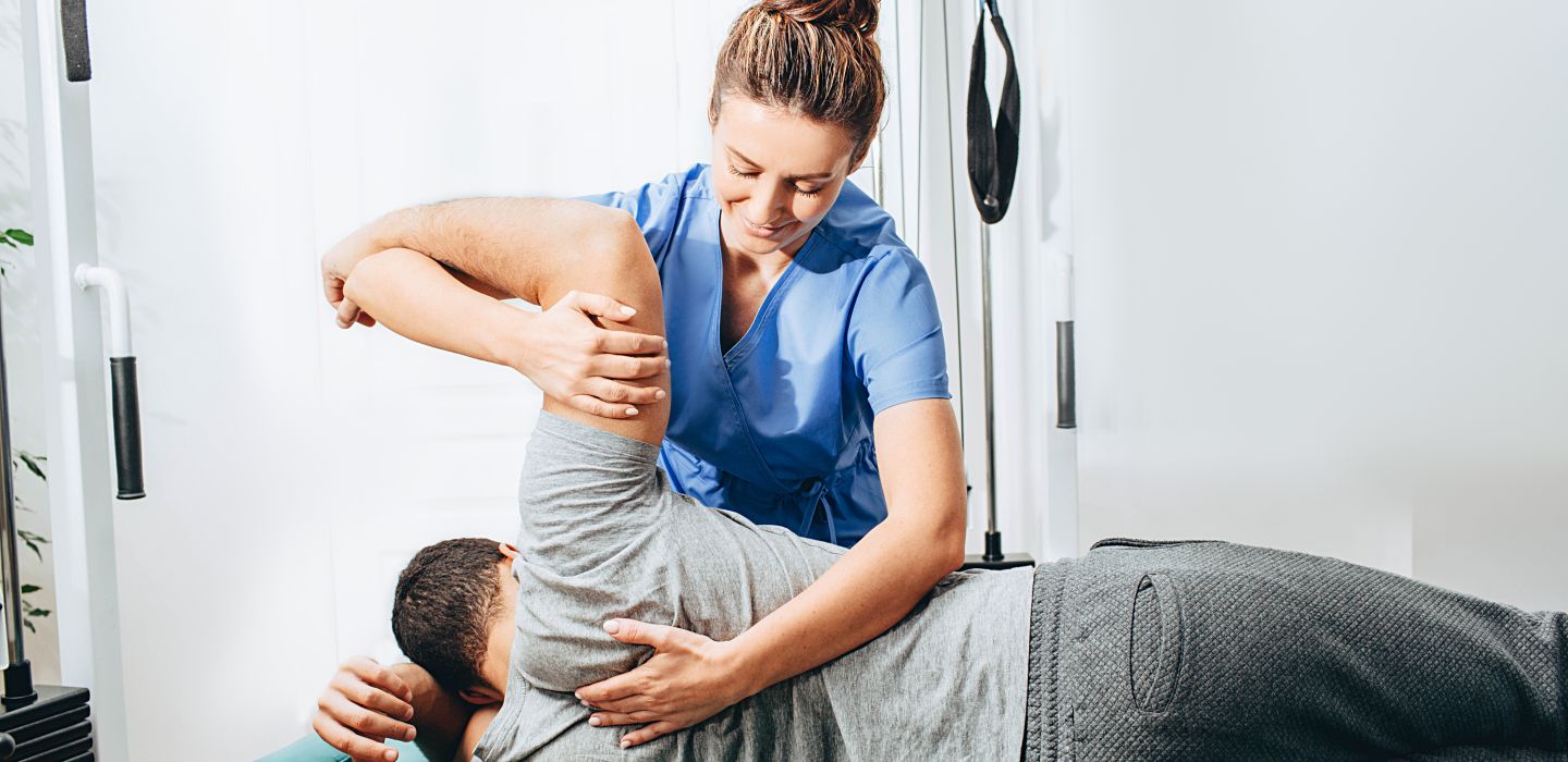 Off campus female physiotherapist with patient