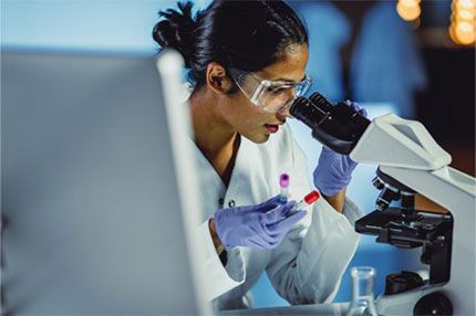 Off campus female scientist looking through scope