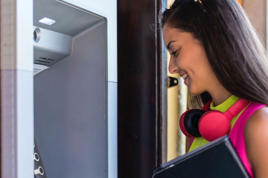 Off campus female using ATM