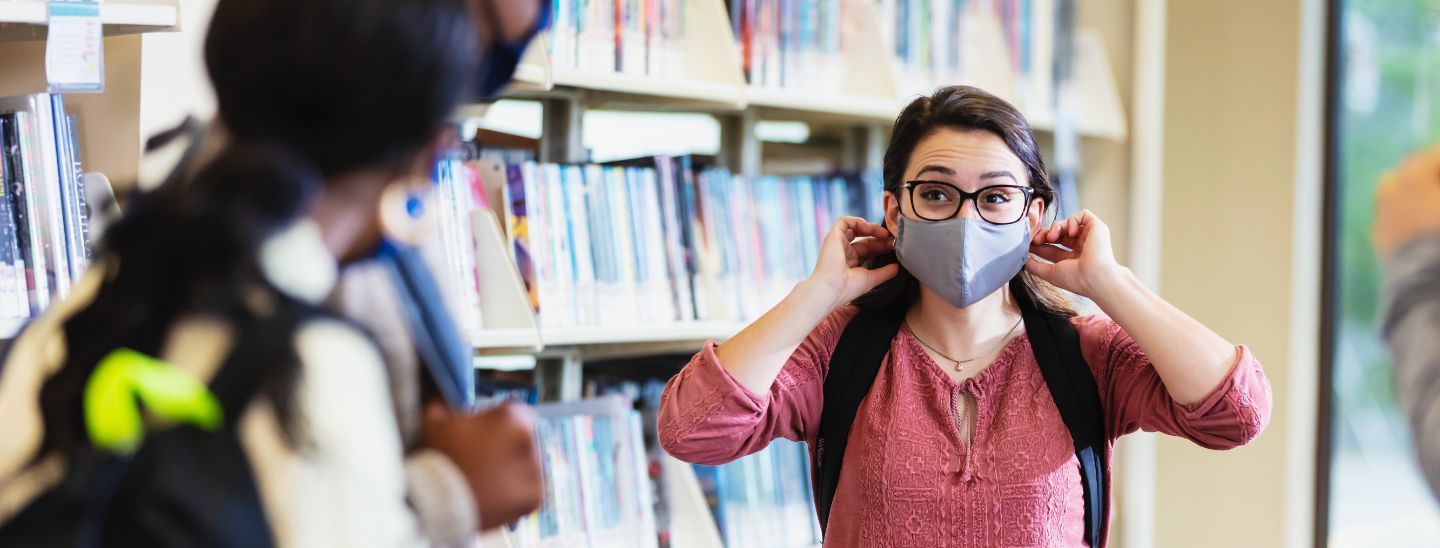 Off campus female wearing mask
