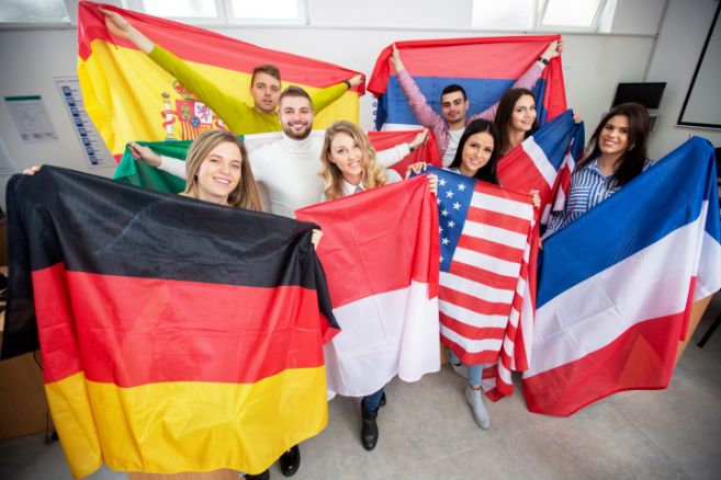 Off campus group holding flags