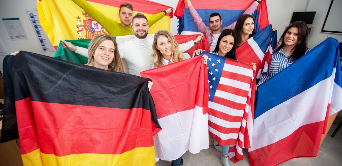 Off campus group holding flags