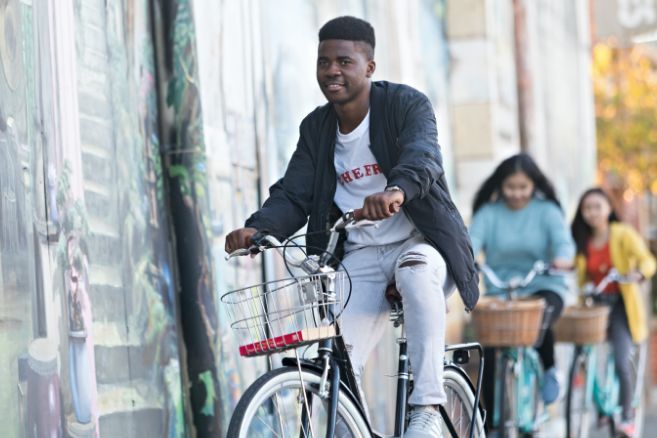 Off campus group riding bikes