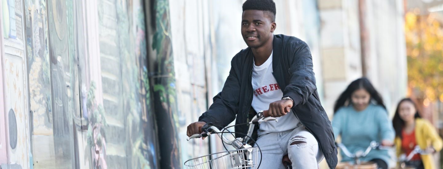 Off campus group riding bikes