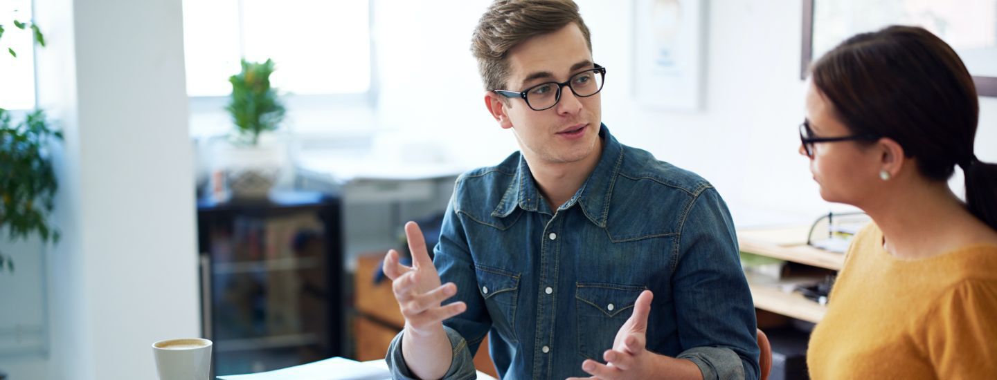 Off campus male and female discussing