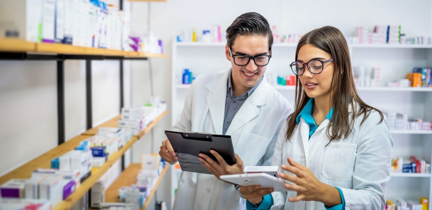 Off campus male and female in pharmacy store