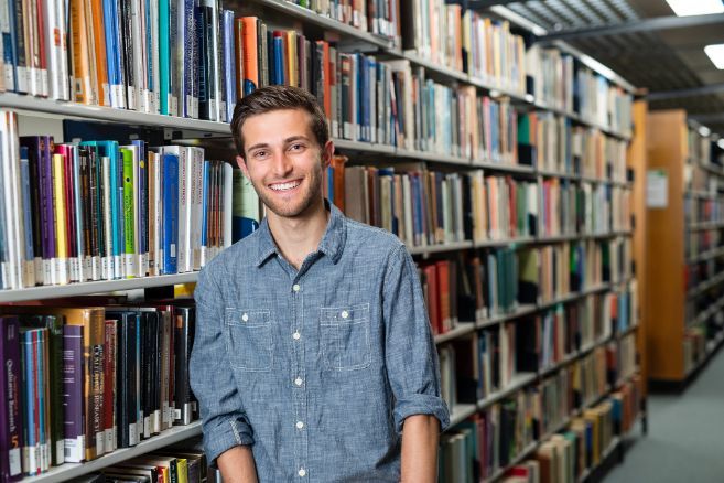 Off campus male in library