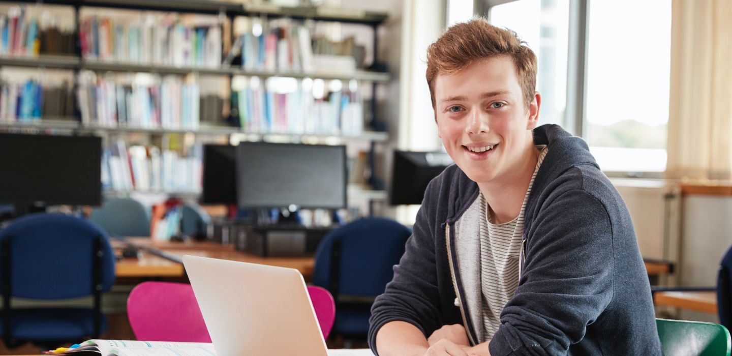 Off campus male on laptop