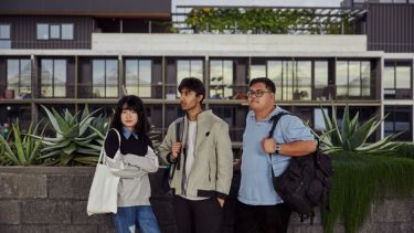 Malaysia students standing outside in the campus